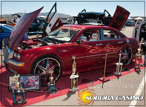 Red highly customized 2007 Chrysler 300 looks like an awarding winning car